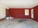 A clean and tidy carport featuring red wood paneling on the interior walls and cement flooring at 2870 Whiteview Nw Dr, Acworth, GA 30101