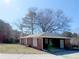 Charming brick home featuring a single-story layout, a manicured lawn, and a private driveway at 2870 Whiteview Nw Dr, Acworth, GA 30101