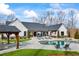 Amazing backyard with a large pool, outdoor seating, and a covered patio at 8710 Little Mill Rd, Cumming, GA 30041