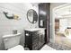 Bathroom featuring a gray vanity with marble countertop and a decorative mermaid ornament at 8710 Little Mill Rd, Cumming, GA 30041