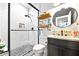 Modern bathroom features a black framed glass enclosed shower and industrial style shelving at 8710 Little Mill Rd, Cumming, GA 30041