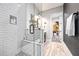 Modern bathroom features a glass-enclosed shower with stone pebble floor at 8710 Little Mill Rd, Cumming, GA 30041