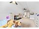 Bedroom boasts vaulted ceilings with a ceiling fan, plush carpeting, and ensuite bathroom at 8710 Little Mill Rd, Cumming, GA 30041