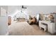 Spacious bedroom with plush carpeting, vaulted ceilings with dual ceiling fans, and ample natural light at 8710 Little Mill Rd, Cumming, GA 30041