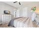 Comfortable bedroom featuring a TV, modern decor, and plenty of storage space at 8710 Little Mill Rd, Cumming, GA 30041