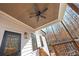 Wood plank patio with exterior ceiling fan and wooded views at 8710 Little Mill Rd, Cumming, GA 30041