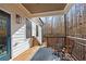 Inviting covered patio offering a relaxing space with views of the wooded surroundings at 8710 Little Mill Rd, Cumming, GA 30041