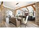 Spacious dining area connects to the living room and features exposed brick and wood accents at 8710 Little Mill Rd, Cumming, GA 30041