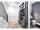 Mud room with a built-in bench and storage, conveniently located next to the powder room at 8710 Little Mill Rd, Cumming, GA 30041