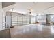 Spacious three car garage with high ceilings, modern lighting, and ample storage space at 8710 Little Mill Rd, Cumming, GA 30041