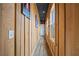 Hallway with wood paneling, with a black ceiling, and a row of windows at 8710 Little Mill Rd, Cumming, GA 30041