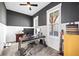 Functional home office space with ample natural light, neutral color palette, and modern desk setup at 8710 Little Mill Rd, Cumming, GA 30041