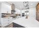 Bright kitchen featuring stainless steel appliances and a large island with modern lighting at 8710 Little Mill Rd, Cumming, GA 30041