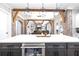 Kitchen island with beverage cooler, white countertops, and brick accents at 8710 Little Mill Rd, Cumming, GA 30041