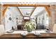 Inviting open-plan living area with exposed beams, brick accents, and fireplace at 8710 Little Mill Rd, Cumming, GA 30041