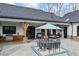 Stylish outdoor kitchen with built-in grill, stainless steel appliances, and a covered dining area for gatherings at 8710 Little Mill Rd, Cumming, GA 30041