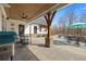 Covered patio with ceiling fan, outdoor seating, and a view of the pool at 8710 Little Mill Rd, Cumming, GA 30041