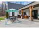 Covered patio with outdoor dining area and built-in grill, perfect for enjoying outdoor meals and entertaining guests at 8710 Little Mill Rd, Cumming, GA 30041