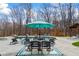 Outdoor living space showcasing a pool, patio, dining area, and lounge chairs for relaxation and entertainment at 8710 Little Mill Rd, Cumming, GA 30041