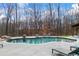 Beautiful backyard pool and patio area, ideal for outdoor recreation and entertaining in a private setting at 8710 Little Mill Rd, Cumming, GA 30041