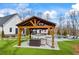 Charming poolside patio with an outdoor seating area under a pergola at 8710 Little Mill Rd, Cumming, GA 30041
