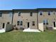 Home's backyard featuring a well-maintained lawn and a back patio at 2677 Pearl Ridge Trce, Buford, GA 30519