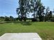 Spacious backyard with a concrete patio and lush green grass at 2677 Pearl Ridge Trce, Buford, GA 30519