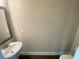 Half bathroom featuring a ceramic sink with a framed mirror and hardwood floors at 2677 Pearl Ridge Trce, Buford, GA 30519