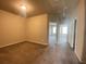 Neutral toned bedroom with plush carpet featuring access to hallway and large window to allow for ample natural light at 2677 Pearl Ridge Trce, Buford, GA 30519