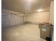 A two car garage with white walls, a trash can, and a garage door opener at 2677 Pearl Ridge Trce, Buford, GA 30519