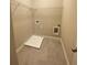 Laundry room equipped with a large tray, wire rack, and utility connections at 2677 Pearl Ridge Trce, Buford, GA 30519