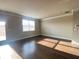 View of the living room with wood floors and a large window providing natural light at 2677 Pearl Ridge Trce, Buford, GA 30519