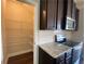 Walk-in pantry, right off the kitchen, filled with adjustable metal shelving at 2677 Pearl Ridge Trce, Buford, GA 30519