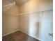 Walk-in closet with wire shelving on carpet floor at 2677 Pearl Ridge Trce, Buford, GA 30519