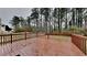 An expansive wooden deck offers a great view of the tree-lined backyard at 8541 Glendevon Ct, Riverdale, GA 30274