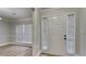 Light and bright entryway featuring hardwood floors and traditional molding at 8541 Glendevon Ct, Riverdale, GA 30274