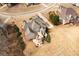 Aerial view of a property showcasing a spacious backyard with a large deck and beautiful landscaping at 1227 Castle Point Sw Ct, Conyers, GA 30094