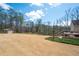 A well-manicured lawn and landscaped yard provide a park-like setting at 1227 Castle Point Sw Ct, Conyers, GA 30094