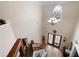 Bright, two-story foyer with decorative front doors, chandelier, and hardwood floors at 1227 Castle Point Sw Ct, Conyers, GA 30094