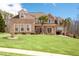 Lovely two-story home with a manicured lawn and well-maintained landscaping, offering great curb appeal at 1227 Castle Point Sw Ct, Conyers, GA 30094