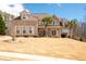 Lovely two-story home with a manicured lawn and well-maintained landscaping, offering great curb appeal at 1227 Castle Point Sw Ct, Conyers, GA 30094