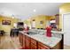 Spacious open kitchen with stainless appliances and granite countertops at 1227 Castle Point Sw Ct, Conyers, GA 30094