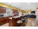 Open kitchen with an island and bar seating with a view of the living area at 1227 Castle Point Sw Ct, Conyers, GA 30094