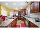 Gourmet kitchen with granite counters, stainless appliances, and custom cabinetry at 1227 Castle Point Sw Ct, Conyers, GA 30094