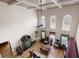 Grand living room with coffered ceilings, large windows, and hardwood floors at 1227 Castle Point Sw Ct, Conyers, GA 30094