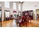 Spacious living room with high ceilings, tall windows, and hardwood floors at 1227 Castle Point Sw Ct, Conyers, GA 30094