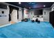 Finished basement complete with blue carpet and sports memorabilia at 1227 Castle Point Sw Ct, Conyers, GA 30094