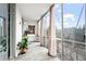 Enclosed patio with tile flooring, city views and neutral drapes at 130 26Th Nw St # 511, Atlanta, GA 30309