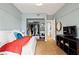 Cozy bedroom features parquet floors, balcony access, and ample storage at 130 26Th Nw St # 511, Atlanta, GA 30309