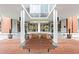 Inviting building entrance with a well-maintained brick walkway and park bench at 130 26Th Nw St # 511, Atlanta, GA 30309